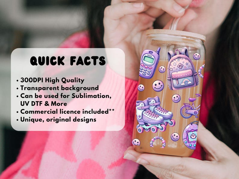 May include: A glass tumbler with a wooden lid and straw, decorated with stickers of a purple cell phone, backpack, roller skates, bicycle, and smiley faces. The tumbler is filled with a light brown liquid.