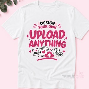 May include: A white short-sleeve t-shirt featuring a graphic design in black and pink. The text reads "DESIGN YOUR OWN" and "UPLOAD ANYTHING" with icons of a picture, a t-shirt with a heart, an upload arrow, a text box, and a star.