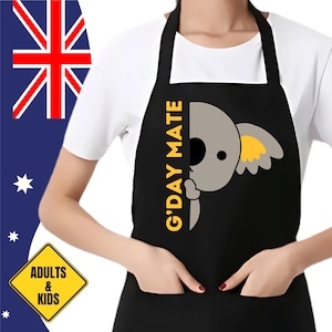 May include: Black apron featuring a cartoon koala bear and the text "G'DAY MATE" in yellow. The apron has two pockets and is suitable for adults and kids.