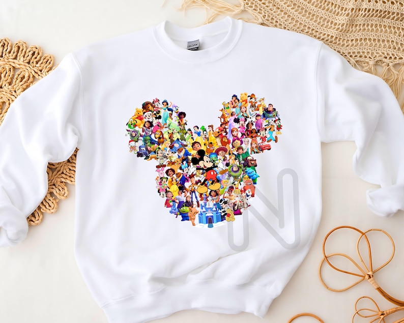 May include: White sweatshirt with a colorful Mickey Mouse silhouette made up of various Disney characters.