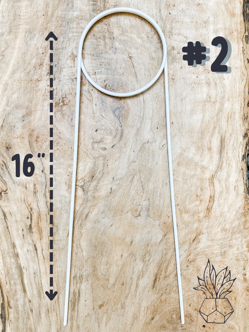 May include: White metal plant stand with a 16-inch height and a circular top. The stand is labeled #2.