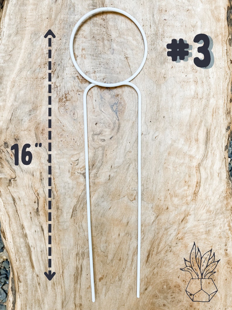 May include: White metal plant stand with a 16-inch tall support and a circular top. The stand is labeled #3.