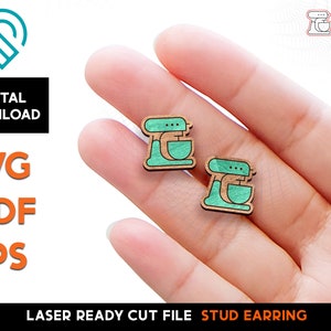 May include: A pair of wooden stud earrings featuring a teal-coloured stand mixer design. The earrings are laser cut and ready to be used.