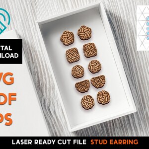 May include: A white box with a variety of brown wooden stud earrings arranged in rows. The earrings are in the shape of knots and are laser cut. The text "LASER READY CUT FILE STUD EARRING" is printed on the bottom of the box.