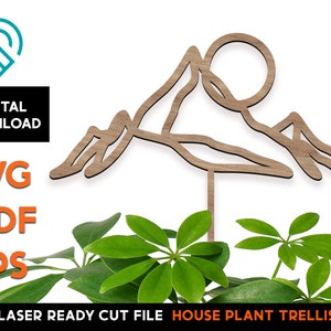 Puede incluir: Enrejado de madera para plantas de interior cortado con láser en forma de montaña con un sol. El enrejado está diseñado para ser utilizado con una planta de interior para ayudarla a crecer hacia arriba.