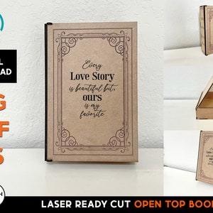Puede incluir: Libro de tapa abierta cortado con láser con acabado en madera marrón. La parte delantera del libro tiene un marco decorativo y el texto "Every Love Story is beautiful but ours is my favorite".