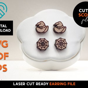 May include: Wooden Halloween-themed earring set. The earrings feature two witch hats and two spiderwebs. The image also includes the text "DIGITAL DOWNLOAD" and "SVG PDF EPS". The earrings are laser cut ready.