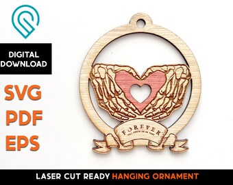 May include: A wooden laser cut ornament featuring two skeletal hands holding a heart with the text "FOREVER TILL DEATH DO US PART" on a banner.