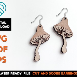 May include: A pair of laser cut wooden earrings shaped like mushrooms. The earrings are brown with a light brown stem and a white cap with a detailed design. The earrings are attached to silver hooks.