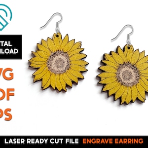 May include: A pair of laser cut wood earrings featuring a sunflower design. The earrings are yellow with a brown center and have silver hooks.
