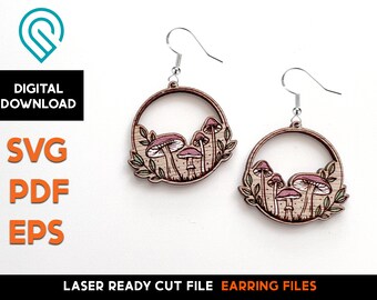 May include: A pair of laser cut wooden earrings featuring a whimsical design of mushrooms and leaves in shades of brown and pink.