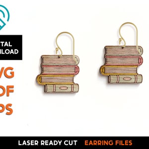 May include: A pair of laser cut wooden earrings shaped like stacks of books. The earrings are painted in shades of pink, yellow, and green. The earrings are ready to be assembled and worn.
