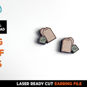 May include: Two laser cut wooden tea bag earrings. The earrings are brown with a green tea leaf design. The earrings are laser ready cut earring files.