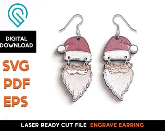 May include: A pair of laser cut wooden earrings featuring a Santa Claus design. The earrings are red, white, and brown with a white beard and a red hat. The earrings are ready to be engraved.