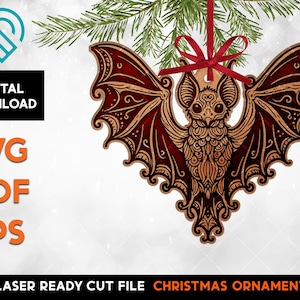 May include: A laser cut file for a Christmas ornament shaped like a bat with intricate details. The bat is dark red with black accents and has a mandala-like design.