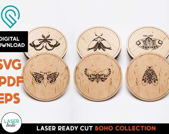 May include: Set of five laser-cut wooden coasters featuring intricate black and white moth designs. The coasters are circular and have a natural wood grain finish.  "LASER READY CUT BOHO COLLECTION" is printed on the bottom of the image.