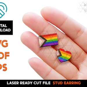 May include: A pair of laser cut stud earrings featuring a rainbow pride flag and a heart shape. The earrings are made of wood and are ready to be assembled.