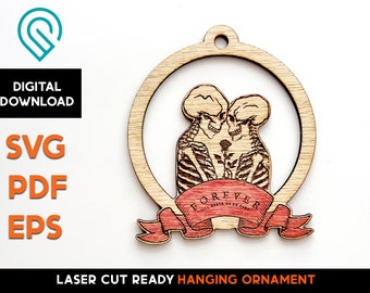 May include: A laser cut wooden ornament featuring two skeletons embracing with a red ribbon that says "FOREVER" in a gothic font.