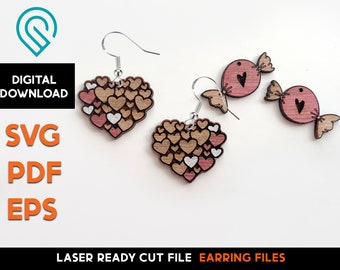 Puede incluir: Pendientes de madera cortados con láser en dos estilos: una forma de corazón llena de corazones más pequeños y una forma de caramelo con un detalle de corazón. Los pendientes son de color rosa y marrón con ganchos plateados.