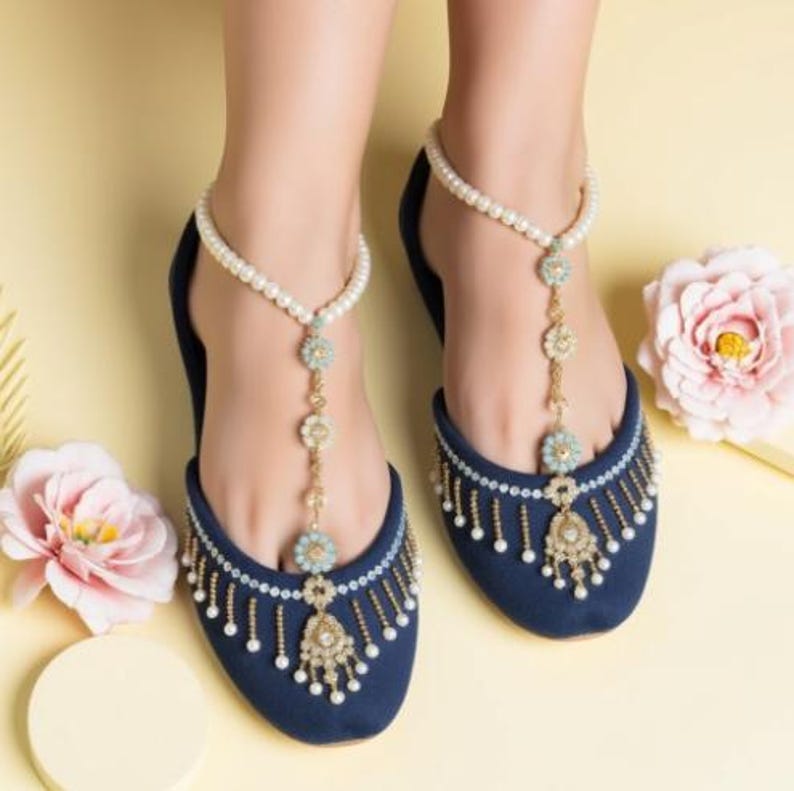 Top-down shot of ethnic navy ballet flats with hand-beaded details, traditional khussa design, artisan-made for weddings and festive wear