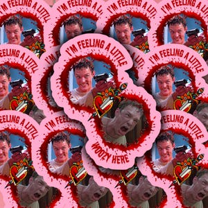 May include: A set of pink and red stickers featuring a man with a gun and the text "I'm feeling a little woozy here".
