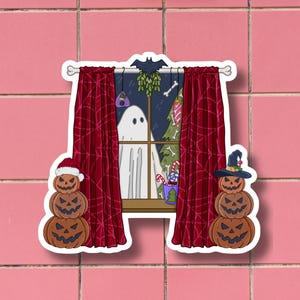 May include: A sticker featuring a window scene with red curtains, a ghost, and a Christmas tree. Two stacks of carved pumpkins flank the window. A bat and mistletoe hang above the window. The sticker has a white border and is set against a pink tile background.