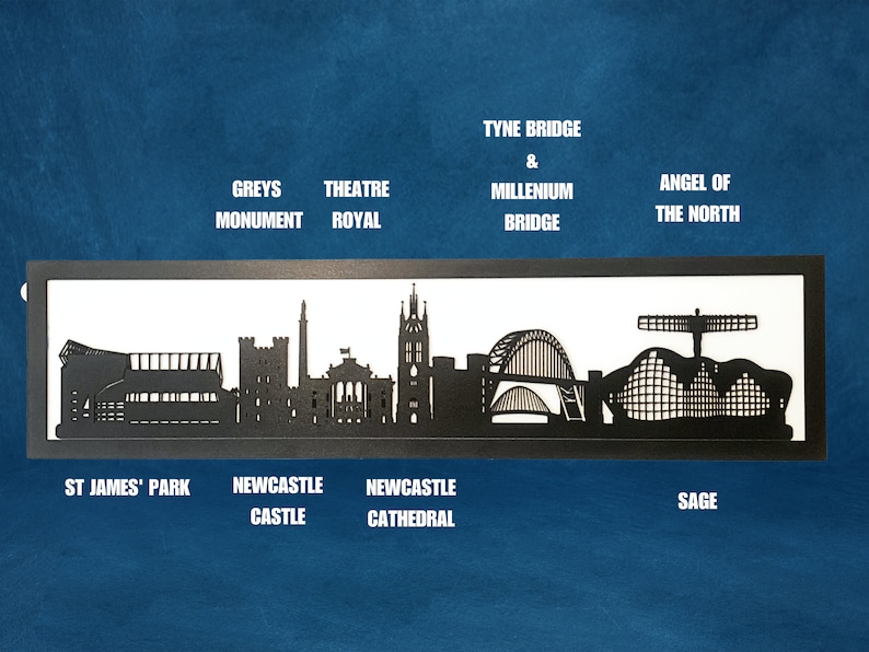 May include: Black and white silhouette of the Newcastle skyline, including St. James' Park, Newcastle Castle, Newcastle Cathedral, Tyne Bridge & Millennium Bridge, and the Angel of the North.