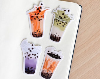 May include: Four illustrated stickers of bubble tea drinks with different flavors. The stickers feature a brown sugar milk tea, a taro milk tea, a matcha milk tea, and a Thai tea. Each sticker has a white background and a splash of liquid coming out of the cup.