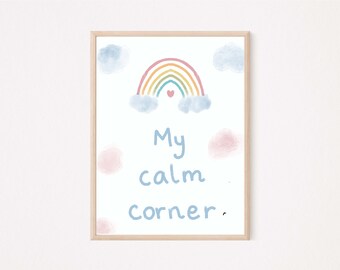 May include: A framed print with a rainbow and clouds in pastel colors. The text "My calm corner" is written in blue below the rainbow.