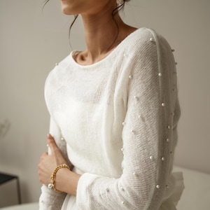 warm shrug for bride,
off the shoulder top,
wedding dress topper,
fall wedding cover,
bridal cover up,
wool wedding sweater,
bridal jacket,
wedding shawl wrap,
wedding sleeves,
offshoulder sweater,
white shrug,
wedding bolero,
spring wedding,