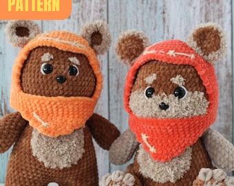 May include: Two brown crocheted plush toys with orange hooded scarves. The toys are inspired by the Star Wars character, Wicket the Ewok.