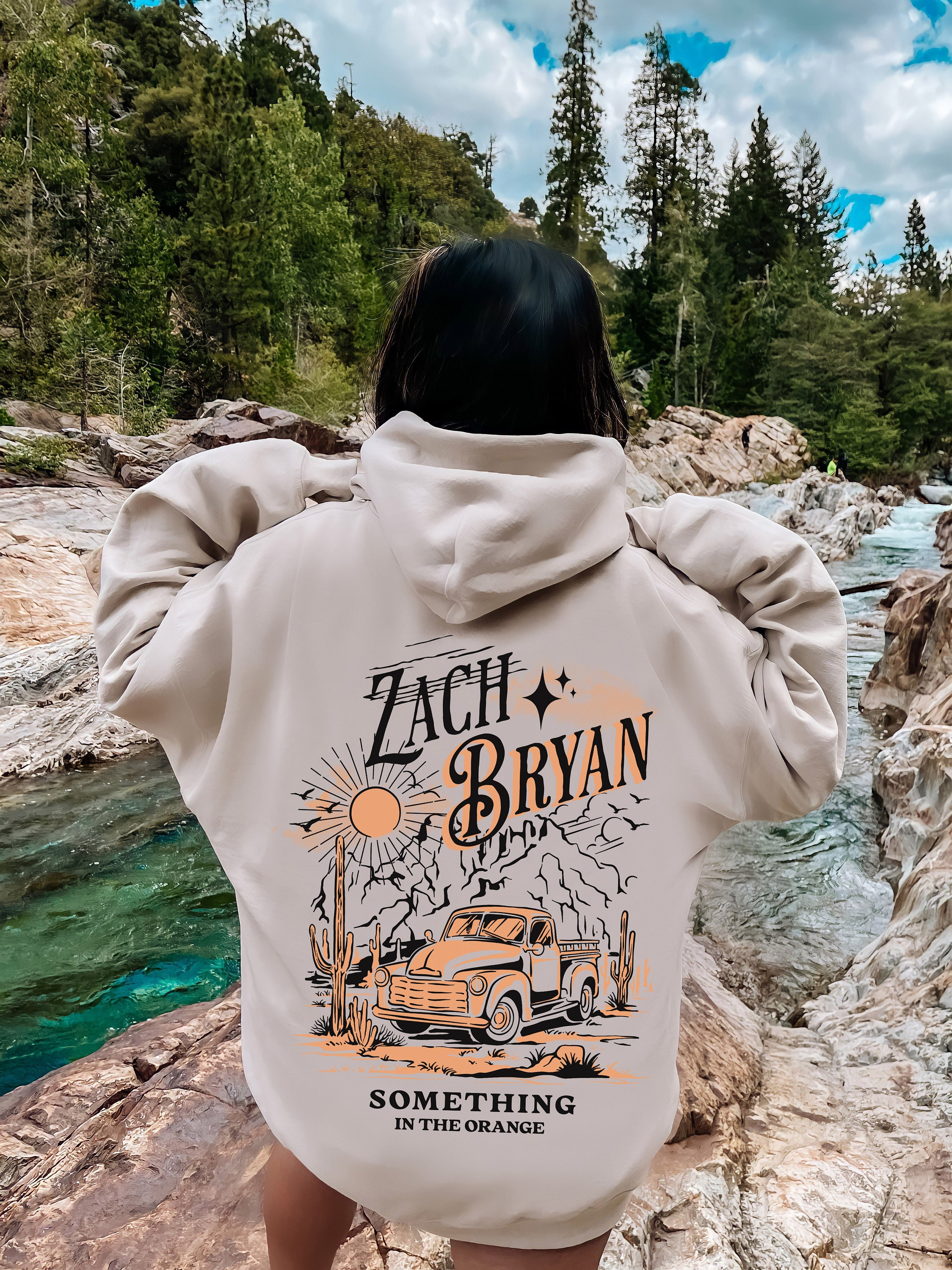 Discover Zach Bryan Something in the Orange Hoodie