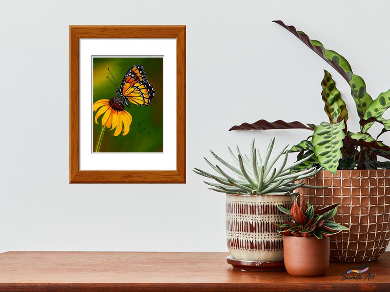 Gouache painting titled 'Flutterby' features a yellow monarch butterfly on a cone flower against a green background. Adds natural elegance to any space.