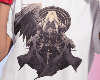 May include: White t-shirt with a graphic print of a character with long blonde hair, wearing armor and a cape, with large black wings. The character is sitting on a throne.