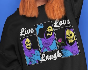 May include: Black sweatshirt with a graphic print of Skeletor from the Masters of the Universe cartoon. The graphic shows Skeletor in three different poses with the text "Live, Love, Laugh".