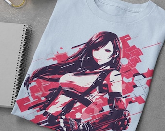 May include: Light blue t-shirt featuring a stylized illustration of a female character with long dark hair and red accents. The graphic is set against a geometric background. Yellow headphones, a notepad, markers, and white shoes are also visible.