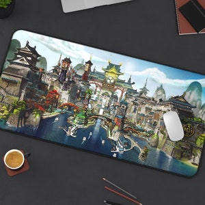 May include: A colourful illustrated mouse mat featuring a detailed cityscape with buildings, bridges, and water. The cityscape is set against a blue sky with white clouds. The mouse mat is rectangular and has a smooth surface.