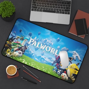 May include: A rectangular mouse mat with the word "PALWORLD" displayed across a colourful landscape with cartoon characters. The design features a blue sky, green grass, and floating islands. A white mouse sits on the mat.