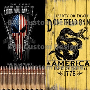 May include: A yellow wooden sign with black text that reads "Liberty or Death Don't Tread On Me" and a black snake with a yellow background. Below the snake is the text "America Land of the Free 1776".