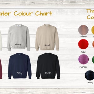 May include: Sweater color chart showing 8 different sweater colors: white, grey, sand, maroon, navy, black, red, and gold. Thread color chart showing 10 different thread colors: white, yellow, orange, red, gold, blue, purple, green, brown, navy, and black.