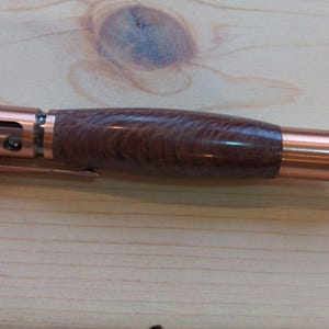 Bolt action pen with Copper finish and Macadamia wood.