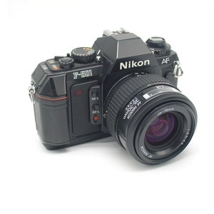 Nikon F-501 point and shoot SLR film camera with zoom lens