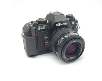 Nikon F-501 point and shoot SLR film camera with zoom lens