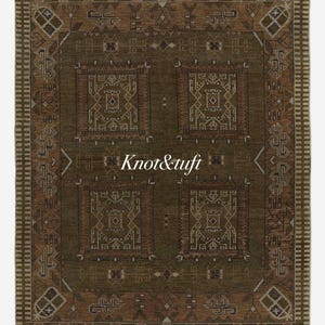 May include: An olive green rectangular rug with a geometric design. The rug has a central pattern of four squares with detailed brown and cream designs. The border features a repeating geometric pattern. The text "Knot&tuft" is visible.