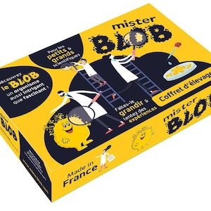 Może przedstawiać: Żółto-czarne pudełko dla "mister BLOB" z ilustracjami naukowców i glutem. Tekst zawiera "Odkryj BLOB, intrygujący organizm!" i "Made in France". Pudełko jest przeznaczone dla małych i dużych naukowców.