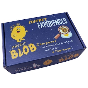 May include: A navy blue box with the words "COFFRET EXPERIENCES" and "mister BLOB" in yellow. The box features a cartoon blob character and a magnifying glass over an egg. Text on the box reads "Comparez les différentes souches & mettez-les à l'épreuve!" and "Made in France."