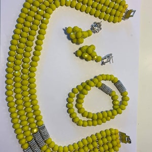 Yellow colour 4layered beads set of earrings, necklace and bracelet.