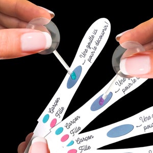 Baby gender announcement color changing pregnancy test. Chemistry experiment announces girl or boy