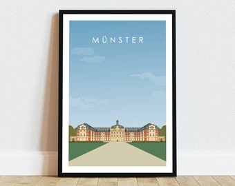 Op de afbeelding: Een zwart ingelijste poster met een minimalistische illustratie van een gebouw in Münster, Duitsland. Het gebouw is lichtgeel met rode accenten en een groen dak. De lucht is blauw met witte wolken. De tekst "MÜNSTER" is in wit bovenaan de poster gedrukt.