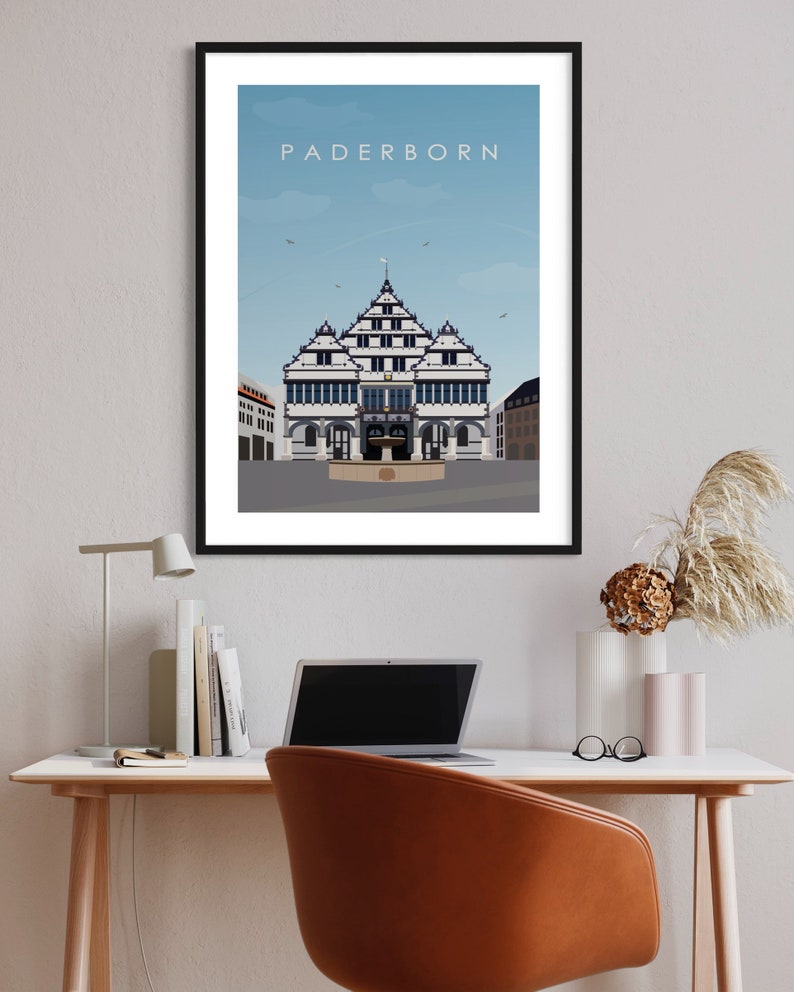 K&ouml;nnte beinhalten: Eine Schwarzwei&szlig;illustration eines Geb&auml;udes mit blauem Himmel im Hintergrund. Das Geb&auml;ude hat ein spitzes Dach und viele Fenster. Der Text "Paderborn" befindet sich oben im Bild.